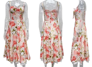 Detail of floral maxi dress showing lace hem, heart neckline, and red rose patterns