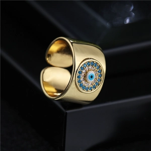 18K gold plated wide open ring with micro-set Evil Eye design and blue zircons