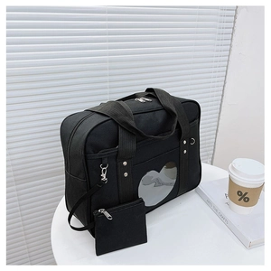 Detail of black Japanese JK uniform tote bag featuring a clear heart window and coin purse