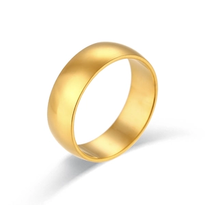 Elegant 18K gold plated minimalist stainless steel band ring for women in studio lighting