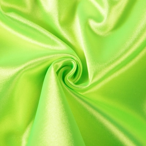 Macro shot of lime green satin fabric texture showing smooth drape and glossy sheen