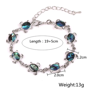 Detailed view of turtle bracelet with colorful shell inlay, 19+5cm length and 13g weight