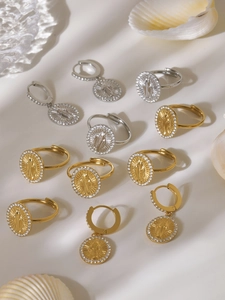 Detailed set of gold and silver Virgin Mary relief earrings and rhinestone rings