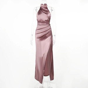 Detailed view of dusty rose satin halter dress with elegant ruching and high side slit