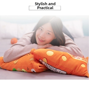 Detail of orange axolotl puff plush pillow with snack bag design held by a model