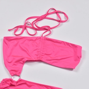 Detail of rose pink off-shoulder bikini top with drawstring and metal ring decoration
