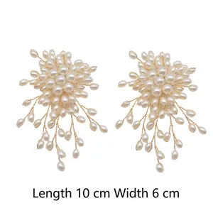 Elegant pearl flower tassel earrings featuring golden wire weave and cascading pearl strands