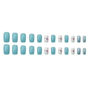 Short square light blue press-on nails with floral patterns and glitter finish
