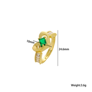 Gold heart ring with green rectangular gemstone and sparkling cubic zirconia stones