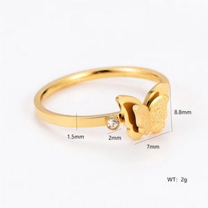 Gold stainless steel butterfly ring with sparkling diamond inlay and frosted metal finish