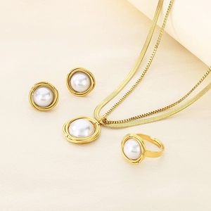 Elegant gold titanium steel jewelry set with pearls featuring layered necklace and ring