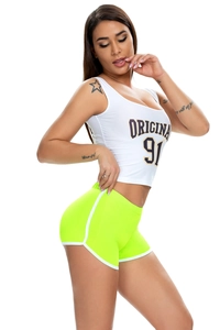 Side view of white crop top with 'ORIGINAL 91' and green neon trim yoga shorts