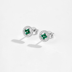 Macro shot of 925 sterling silver clover stud earrings with green gemstones