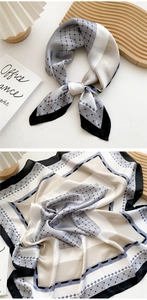 Detail of grey geometric dot pattern square silk scarf with premium smooth texture