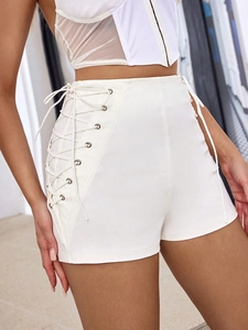 Slim fit white high waisted shorts with lace-up side ties and metal eyelet details