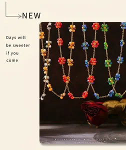 Detail of colorful beaded flower necklace set on a vintage aesthetic background