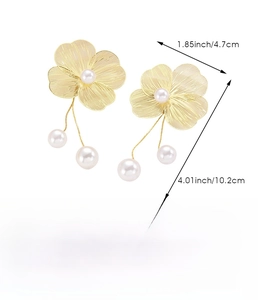 Detail view of hollow flower earrings with pearls including product size and weight specs