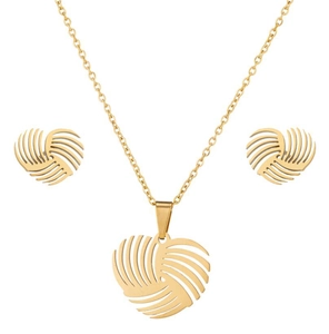 Detailed view of the rotating gold heart pendant necklace and matching stud earrings set
