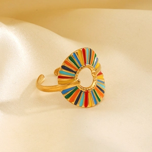Golden stainless steel geometric ring with colorful enamel inlay on beige silk surface