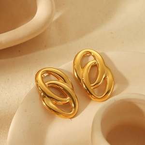Interlocked twisted gold oval hoop earrings in stainless steel for women with polished finish