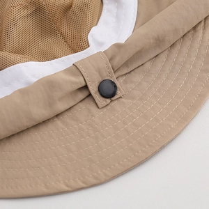 Detail of breathable mesh lining and reinforced stitching on a kid's sun hat