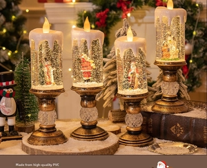 Detailed view of four Christmas LED candle lights with Santa and snowman figurines
