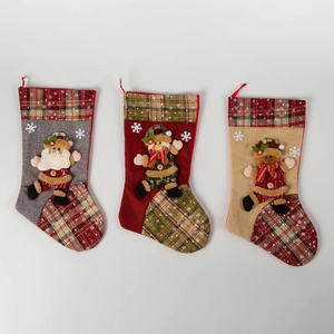 Three Christmas stockings with Santa, Snowman and Reindeer 3D appliques on plaid fabric