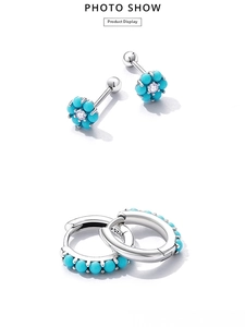 Macro view of 925 sterling silver turquoise flower studs and matching hoop earrings