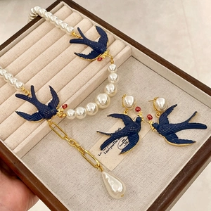 Vintage bird jewelry set with pearl necklace and blue swallow earrings for women
