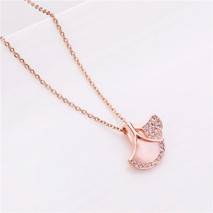 Detail shot of rose gold ginkgo leaf necklace with pink mother of pearl and diamonds