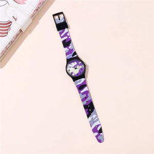 Close-up of children's quartz watch with purple camo silicone strap and numeral dial