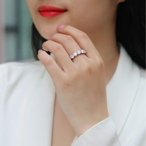 Classic silver 925 sterling silver moissanite eternity band ring worn on woman's finger