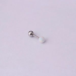 Macro shot of silver cartilage stud featuring a white opal ball and a steel screw back