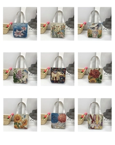 Collection of nine embroidered canvas tote bags featuring diverse floral and artistic patterns