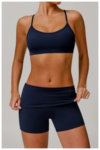 Detail of navy blue back strap sports bra and high-waisted shorts with pro athletic fabric
