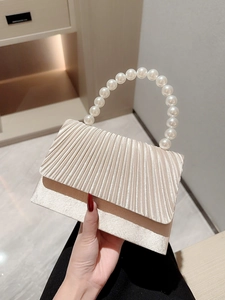 Elegant beige pleated satin evening bag with a pearl handle for formal occasions