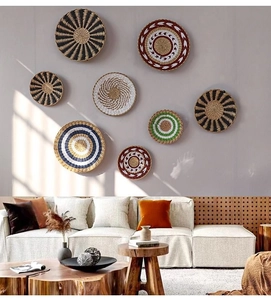 Detail of 8-piece woven seagrass wall basket set in a minimalist Nordic living room