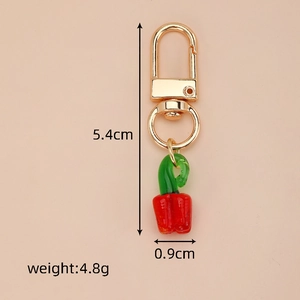 Detail view of mini red chili glass charm with measurements and lobster clasp