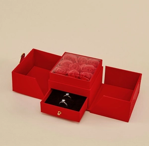 Detail of red jewelry gift box featuring nine soap roses and a slide-out ring drawer