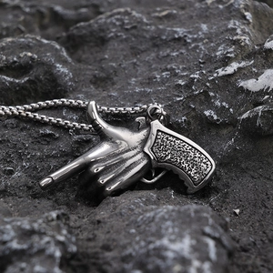 Edgy stainless steel gesture pistol pendant necklace in vintage silver finish
