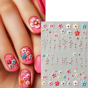 Detailed view of 5D embossed nail stickers featuring colorful 3D floral daisy patterns