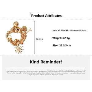 Detail view of gold layered bracelet with ocean charms like starfish, shells and sun