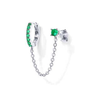 Detailed view of silver chain earrings with green gemstones for double piercings