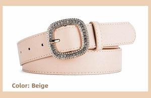 Close-up of beige leather belt featuring a luxury square buckle with shimmering rhinestones