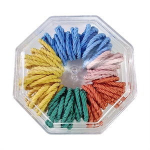 Colorful set of soft elastic hair ties for kids in a clear octagonal storage box