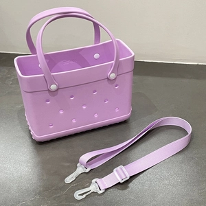 Detailed close-up of a purple EVA beach tote bag with side vent holes and white rivets