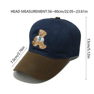 Detail view of cotton baseball cap with bear embroidery and size dimensions marked