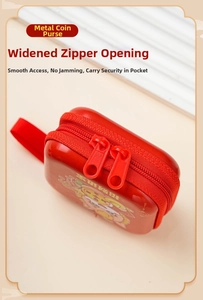 Detail of red tinplate coin purse featuring lucky cat design and smooth wide zipper