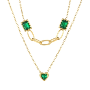 Double layered gold necklace featuring emerald green rectangular gems and a heart pendant
