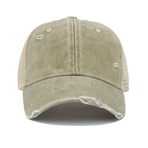 Detailed close-up of distressed cotton mesh trucker hat with breathable holes in khaki